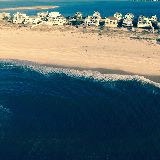 drone photo of house, beach, dune rd., barrier island